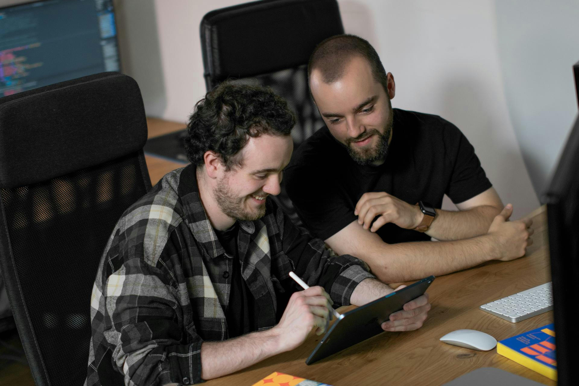Designer and developer working at workspace