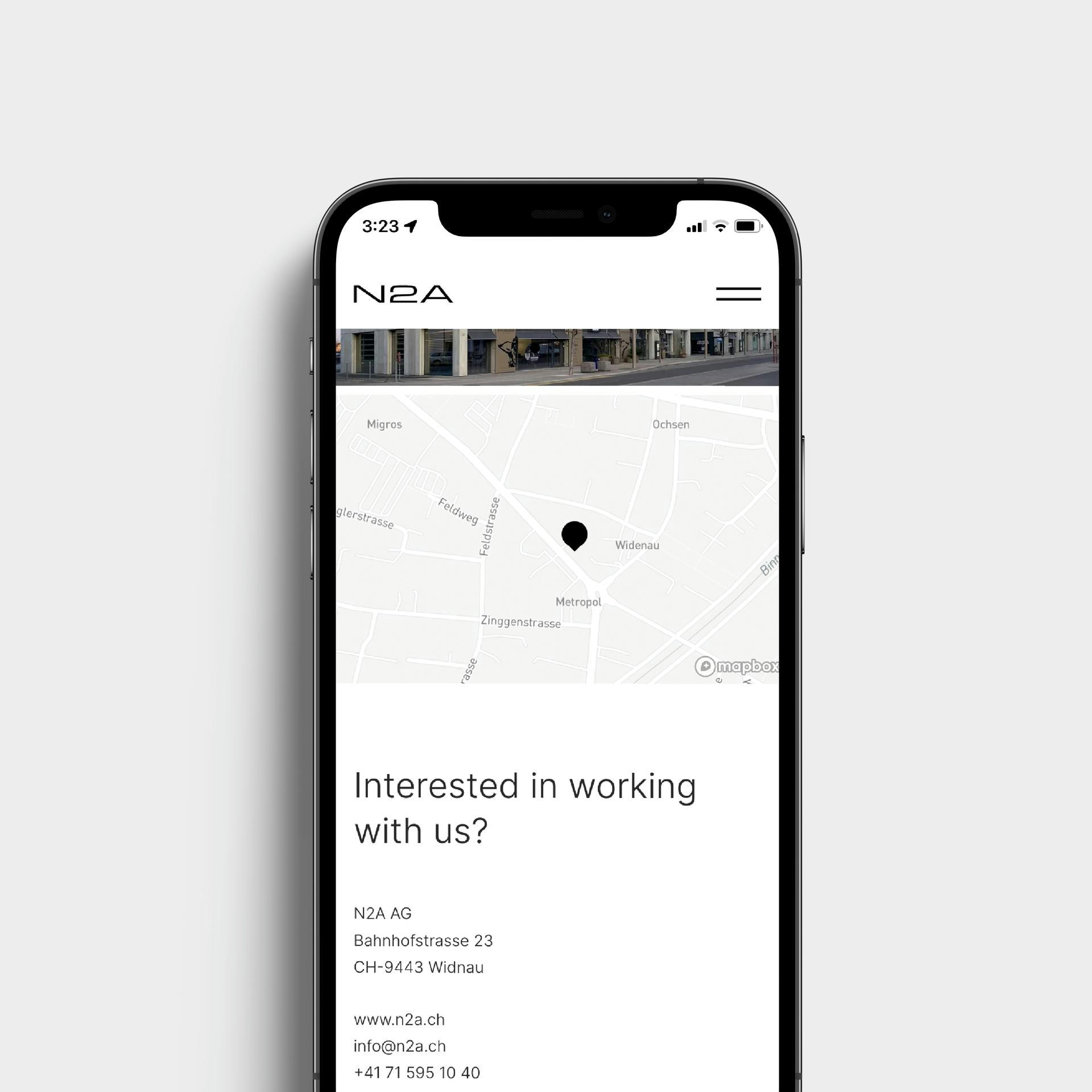 Website mockup the n2a contact page with a location map.